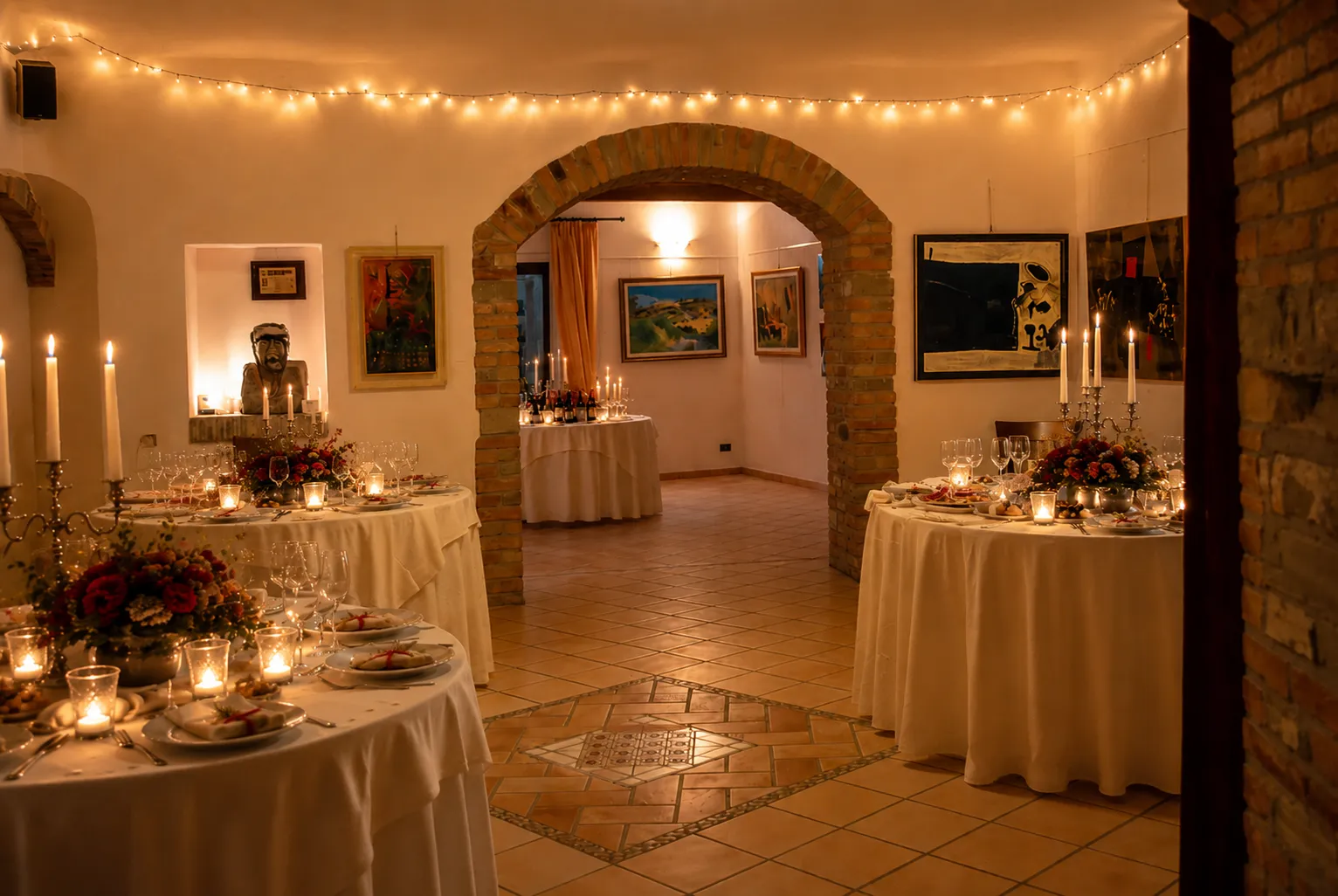 The dining room among brick arches, candles and works of art